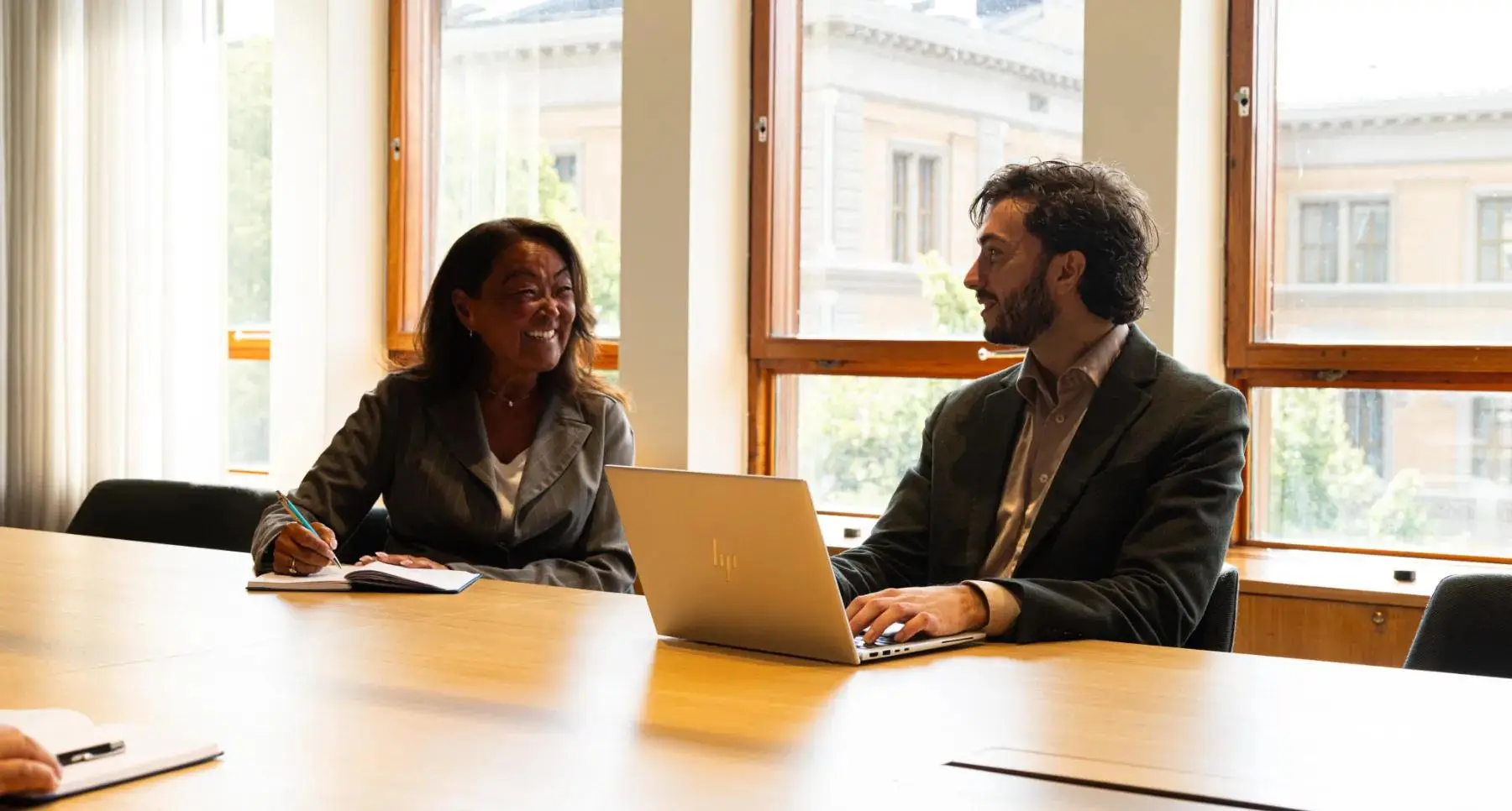 Man and woman having a meeting in one of our meeting rooms